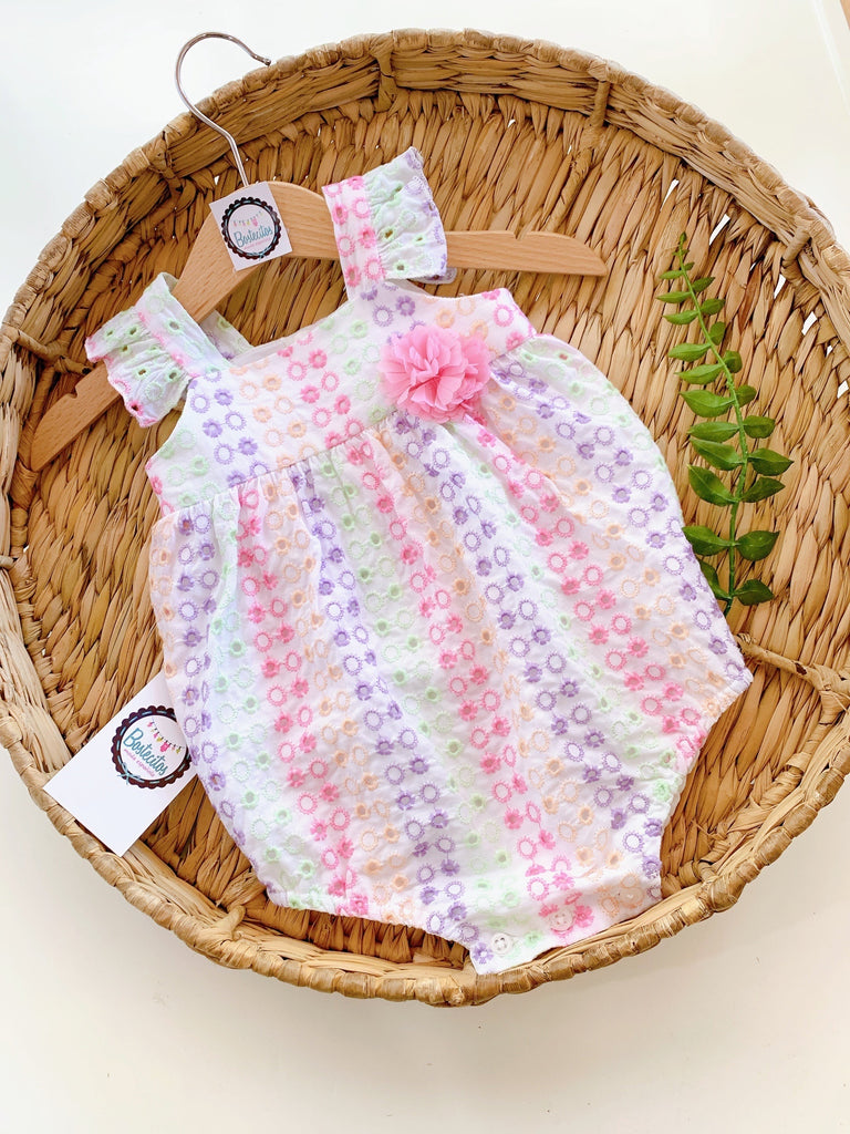 Ranita de colores con flor rosa