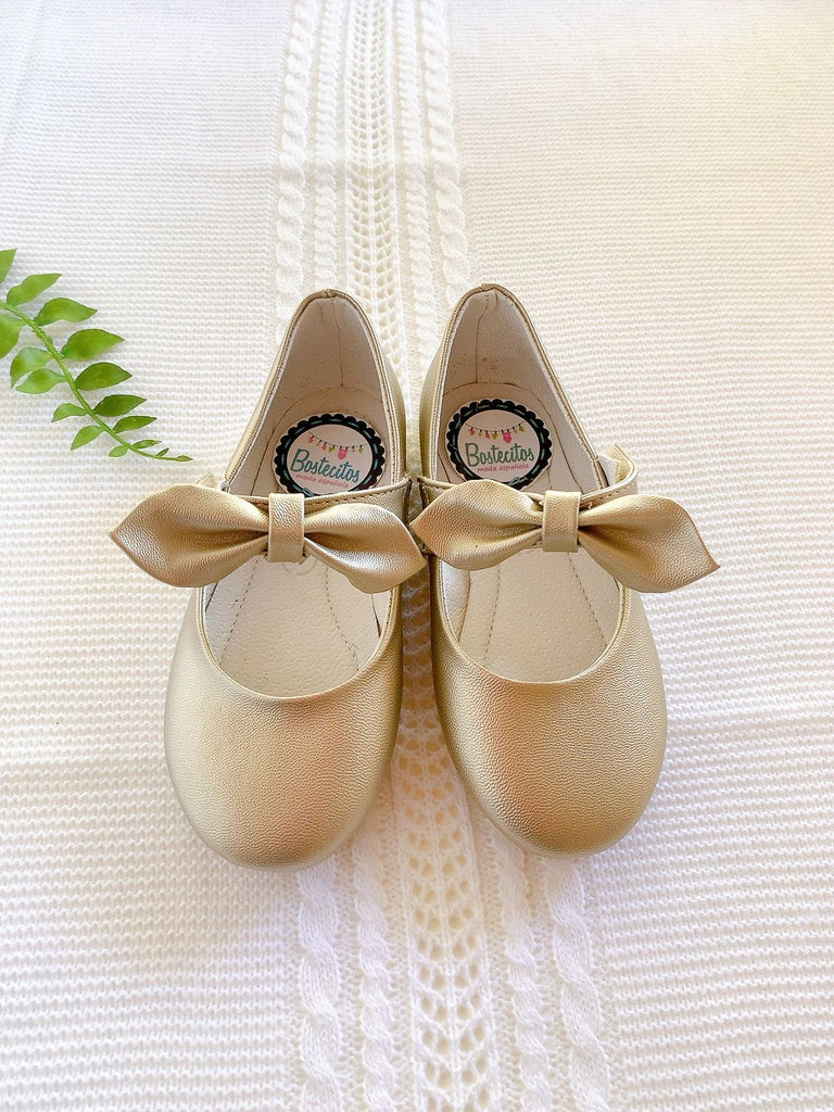 Zapato dorado con moño
