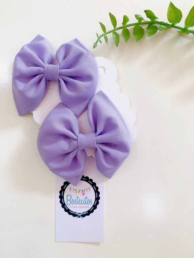 Par de moños lilas para dos colitas
