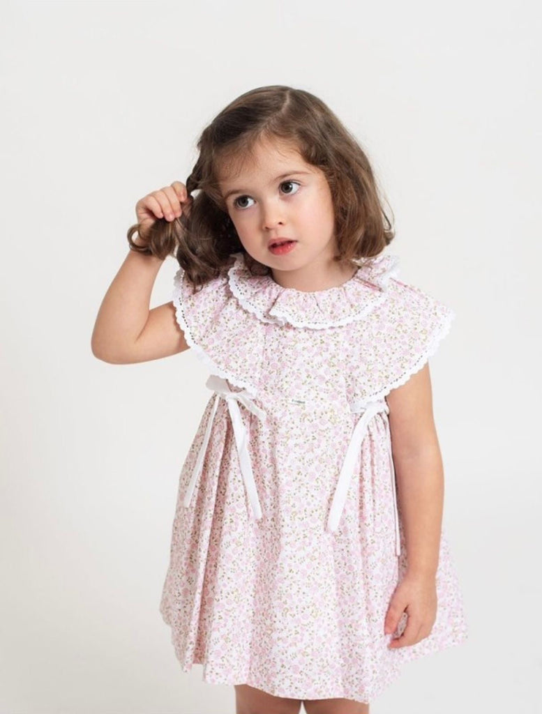 Vestido rosa flores con moños blancos (5 años)